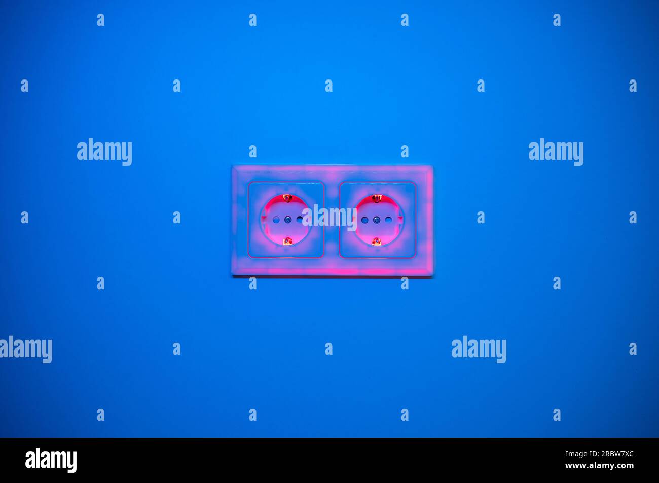 Red illuminated socket to symbolise power consumption and electrical