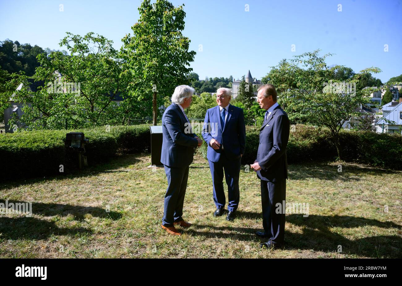 Luxemburg, Luxembourg. 11th July, 2023. German President Frank-Walter Steinmeier (m) and Grand Duke Henri of Luxembourg (r) visit Robert Schuman's birthplace together and are guided through the garden there by Andreas Fickers (l), director of the Luxembourg Center for Contemporary and Digital History. President Steinmeier and his wife are in Luxembourg for a two-day official visit. Schuman was French prime minister. Credit: Bernd von Jutrczenka/dpa/Alamy Live News Stock Photo