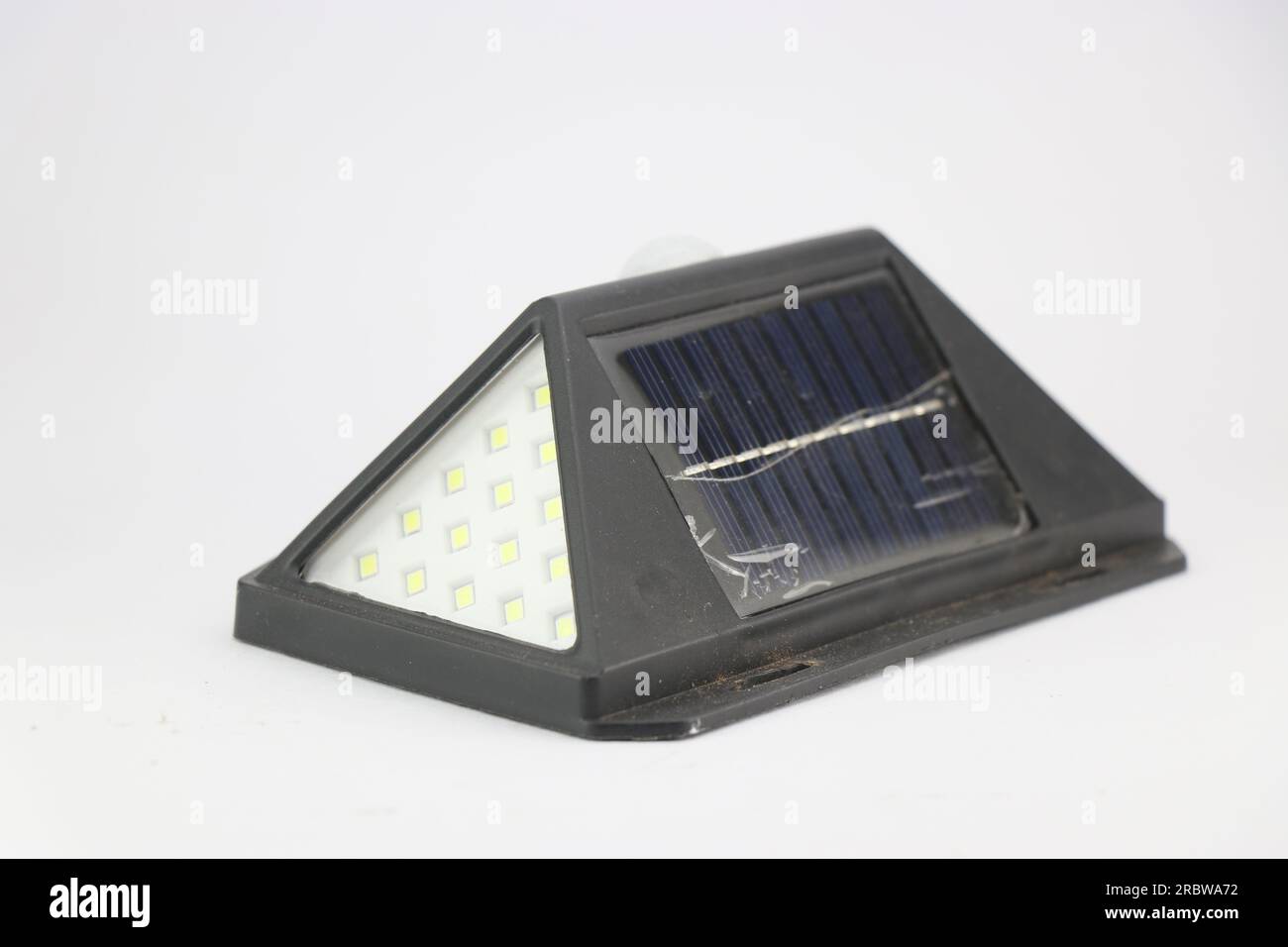 Solar powered garden light with solar panel and energy efficient led bulbs on a white background Stock Photo