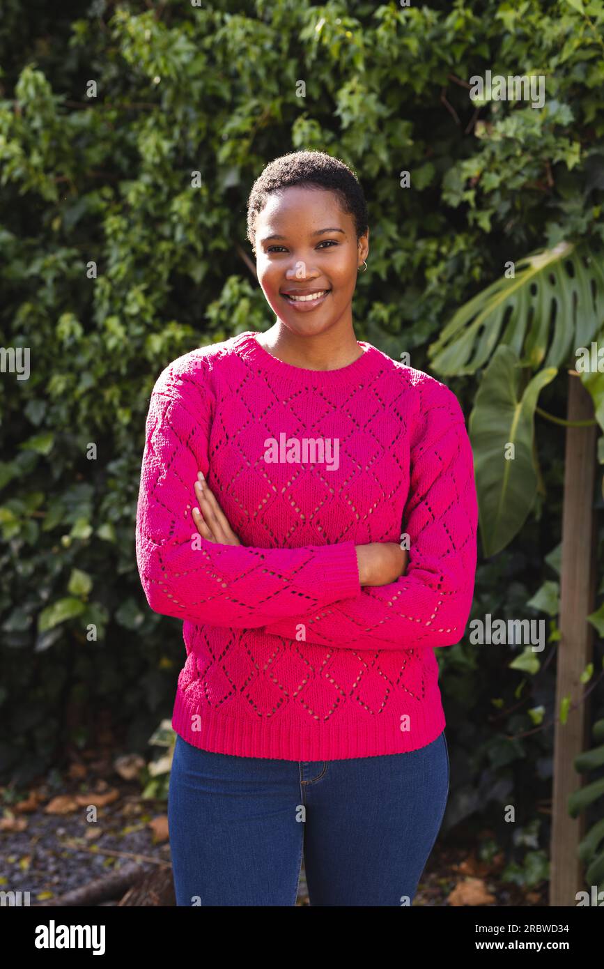 Portrait of happy african american woman in sunny garden Stock Photo ...