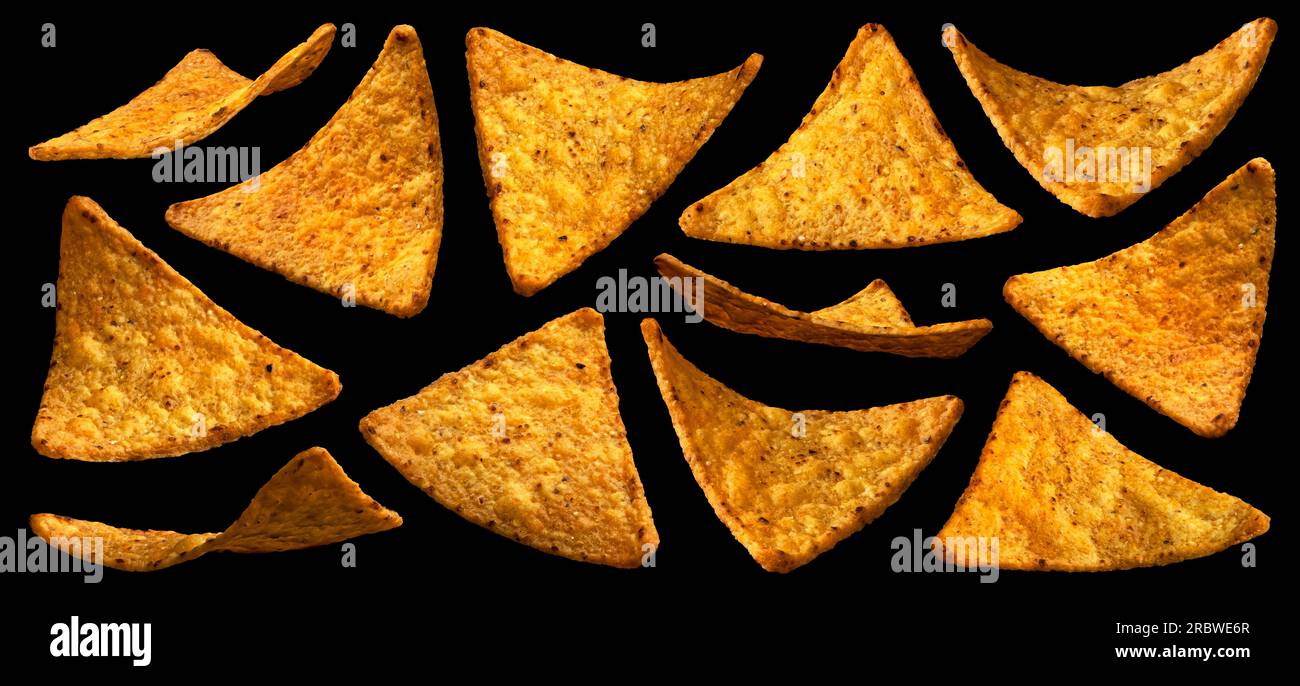 Falling corn chips, hot Mexican nachos isolated on black background