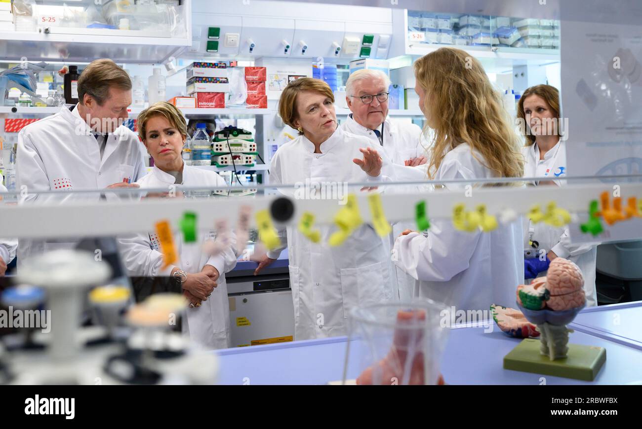 Luxemburg, Luxembourg. 11th July, 2023. Federal President Frank-Walter Steinmeier (3rd from right) and his wife Elke Büdenbender (3rd from left) visit the Luxembourg Centre for Systems Biomedecine (LCSB) together with Grand Duke Henri of Luxembourg (l) and Grand Duchess Maria Teresa of Luxembourg (2nd from left) and are informed about Parkinson's research by Prof. Dr. Anne Grünewald (2nd from right). President Steinmeier and his wife are in Luxembourg for a two-day official visit. Credit: Bernd von Jutrczenka/dpa/Alamy Live News Stock Photo