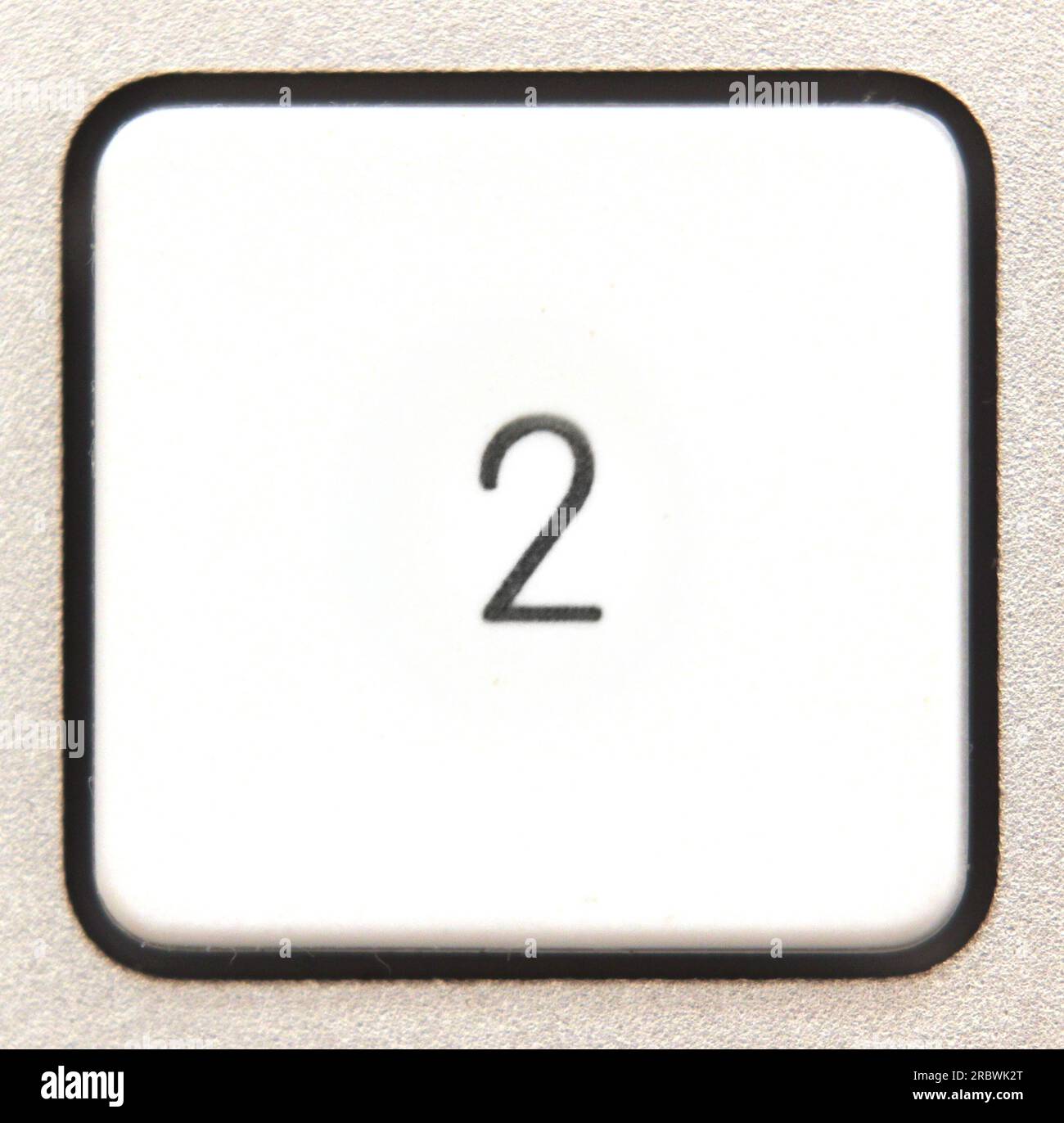 Button 2 from a modern numpad Stock Photo - Alamy
