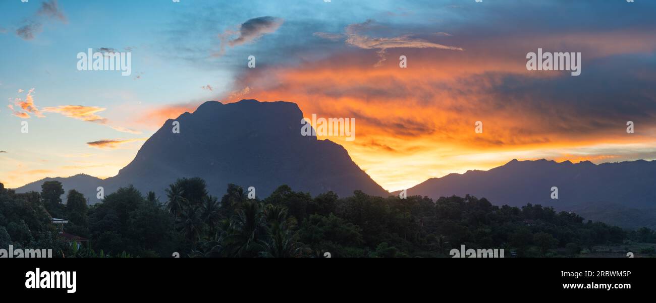 Beautiful landscape panorama of colorful sunset on Doi Luang Chiang Dao limestone mountain, Chiang Dao, Chiang Mai, Thailand Stock Photo