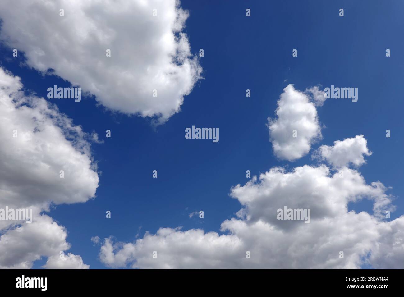 Beautiful bright deep blue sky fluffy white clouds hi-res stock ...