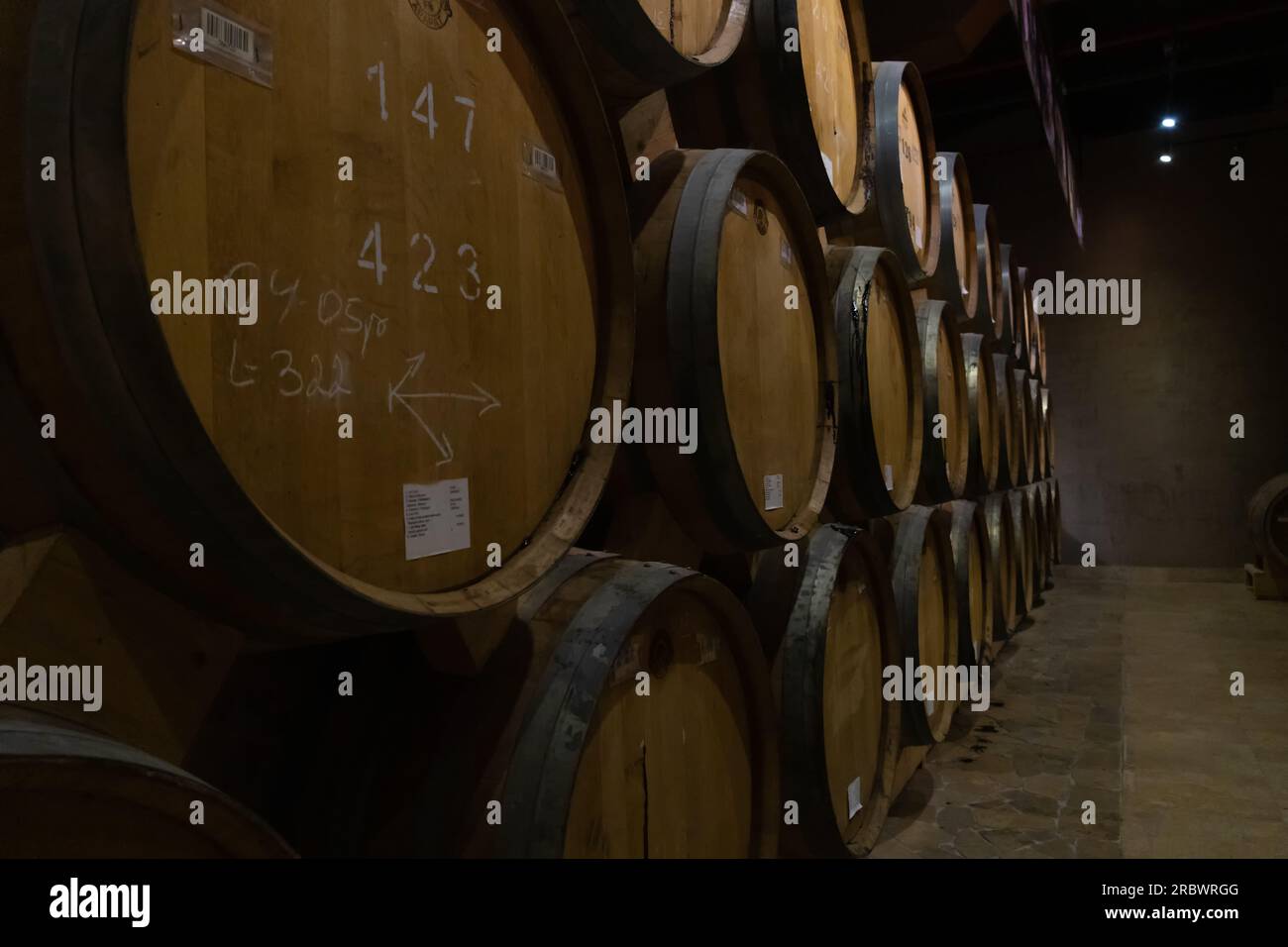 Yerevan, Armenia - May 28 2023: Cellar of the Ararat brandy factory in Yerevan. Close up barrels of cognac in the cellar. Stock Photo