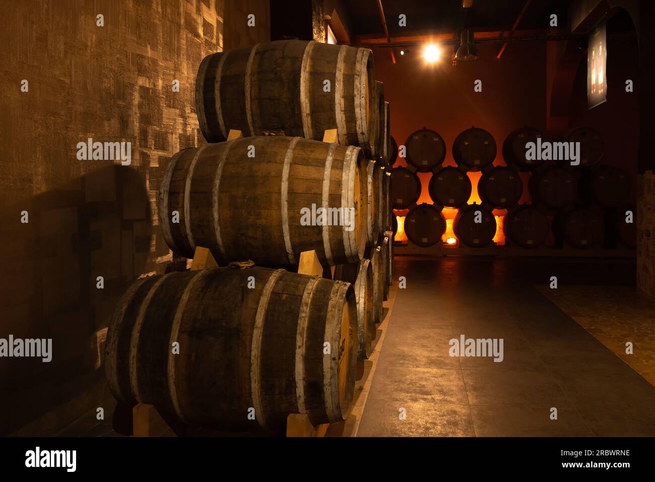 Yerevan, Armenia - May 28 2023: Cellar of the Ararat brandy factory in Yerevan. Close up barrels of cognac in the cellar. Stock Photo