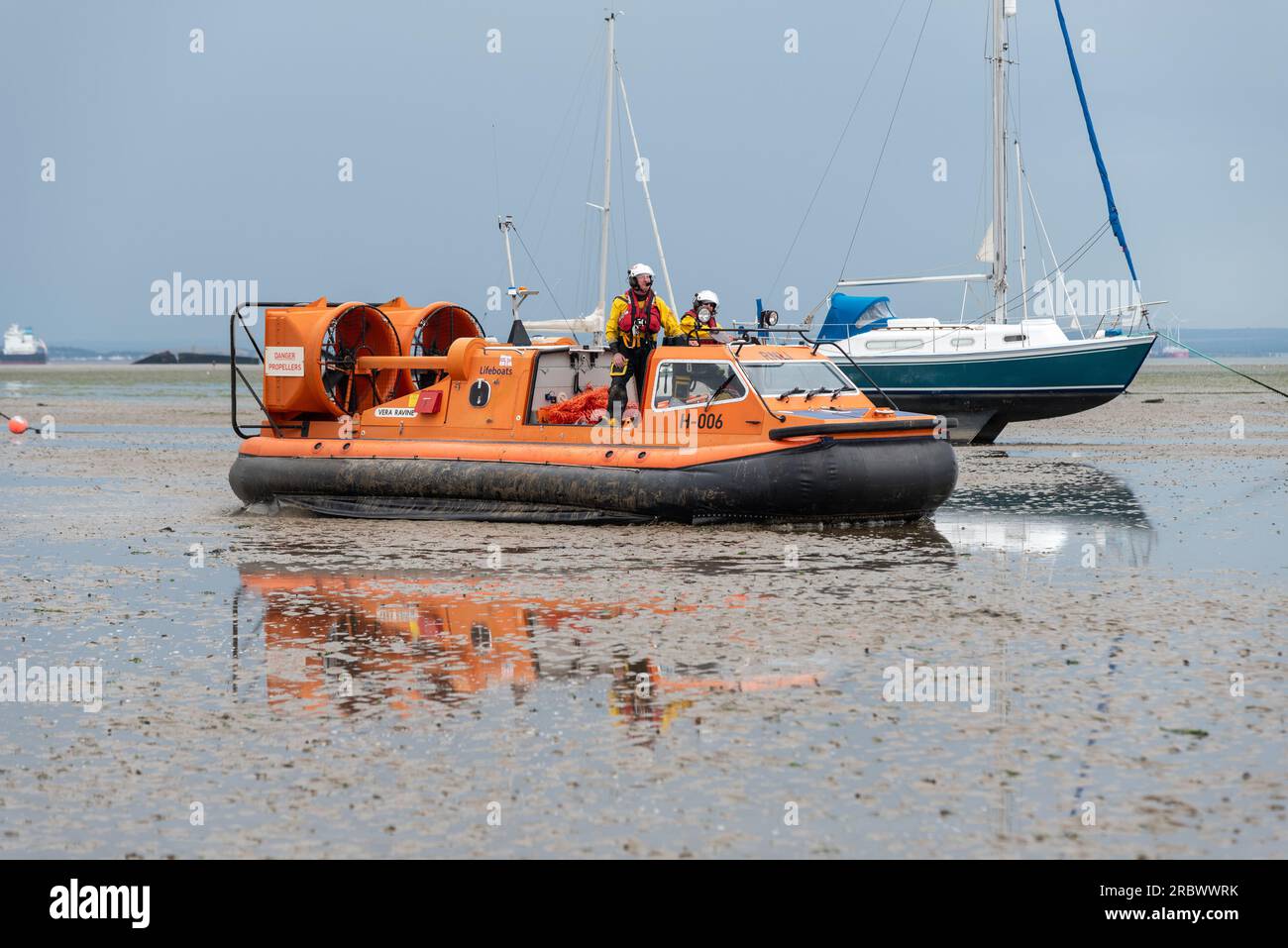 RNLI hovercraft in Southend on Sea, Essex, UK, out on the mud at low tide. Used by Southend RNLI due to large expanse of intertidal zone at low tide Stock Photo