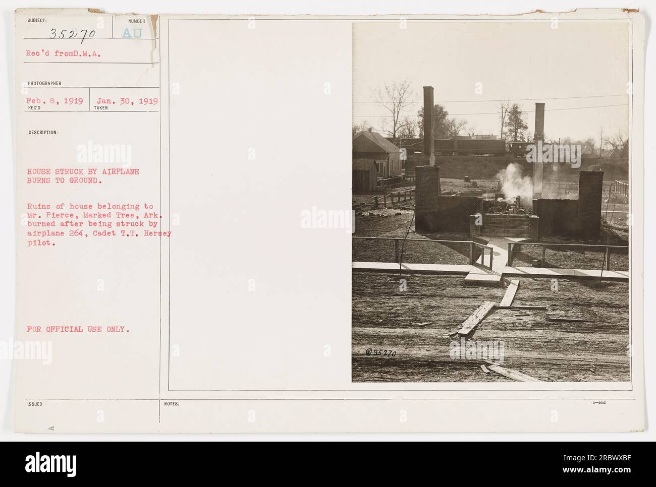 Ruins of a house belonging to Mr. Pierce in Marked Tree, Arkansas burned to the ground after being struck by an airplane flown by Cadet T.T. Hersey. The incident occurred on January 30, 1919, and this photograph was taken on February 8th, 1919. The image is labeled as subject 35270 and is classified for official use only. Stock Photo