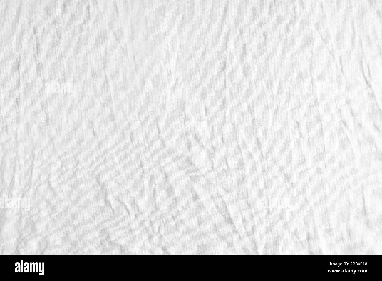 Wrinkled, crumpled white fabric texture background. Wrinkled and