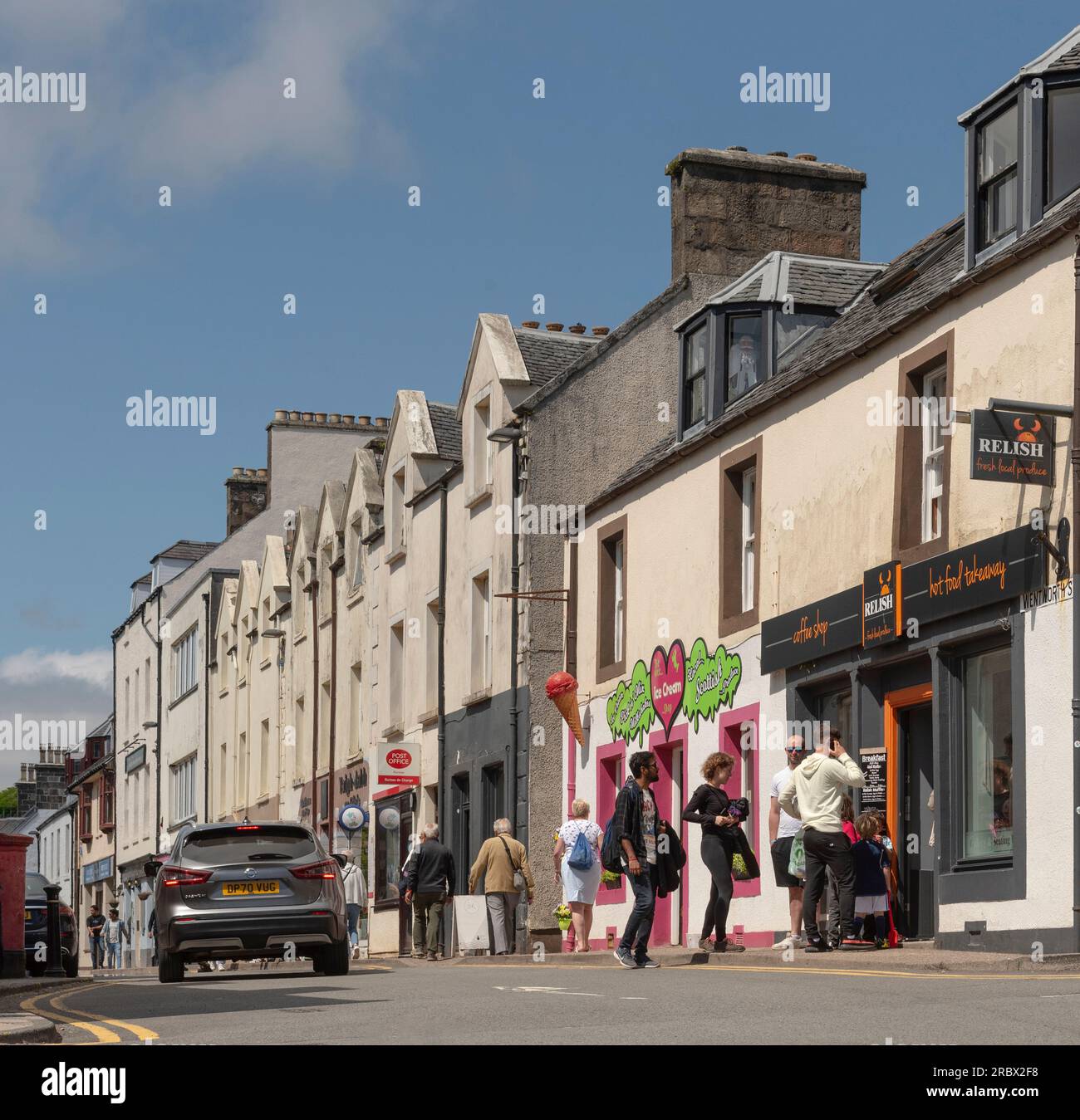 Portree, Isle of Skye, Scotland, UK.  5 June 2023. People queueing outside a coffee shop in the town centre. Stock Photo