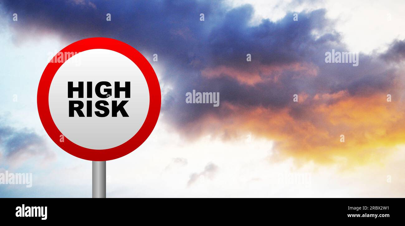 high risk sign on sky background Stock Photo