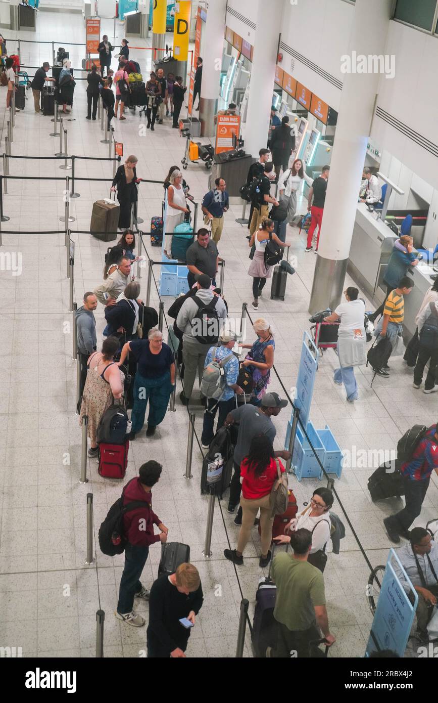 London UK. 11 July 2023   Passengers at Easyjet check in at Gatwick airport. The low budget airline has EasyJet  has cancelled 1,700 summer flights affecting  180,000 passengers which has been  blamed on air-traffic control. Credit amer ghazzal/Alamy Live News Stock Photo