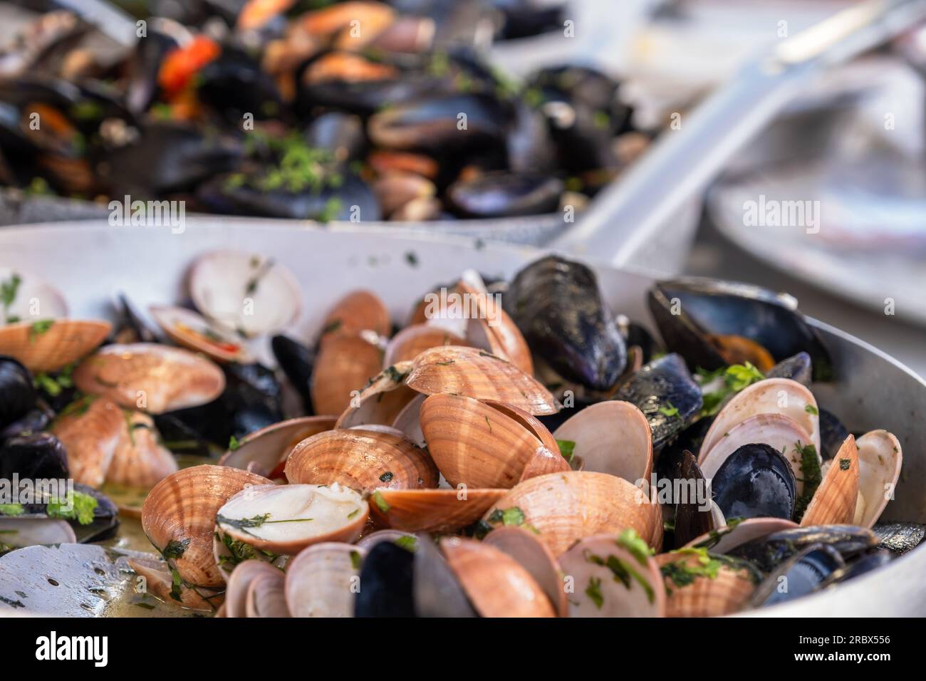 Cooked mussels and seafood in pan, food market Ballaro in Palermo, Sicily Stock Photo