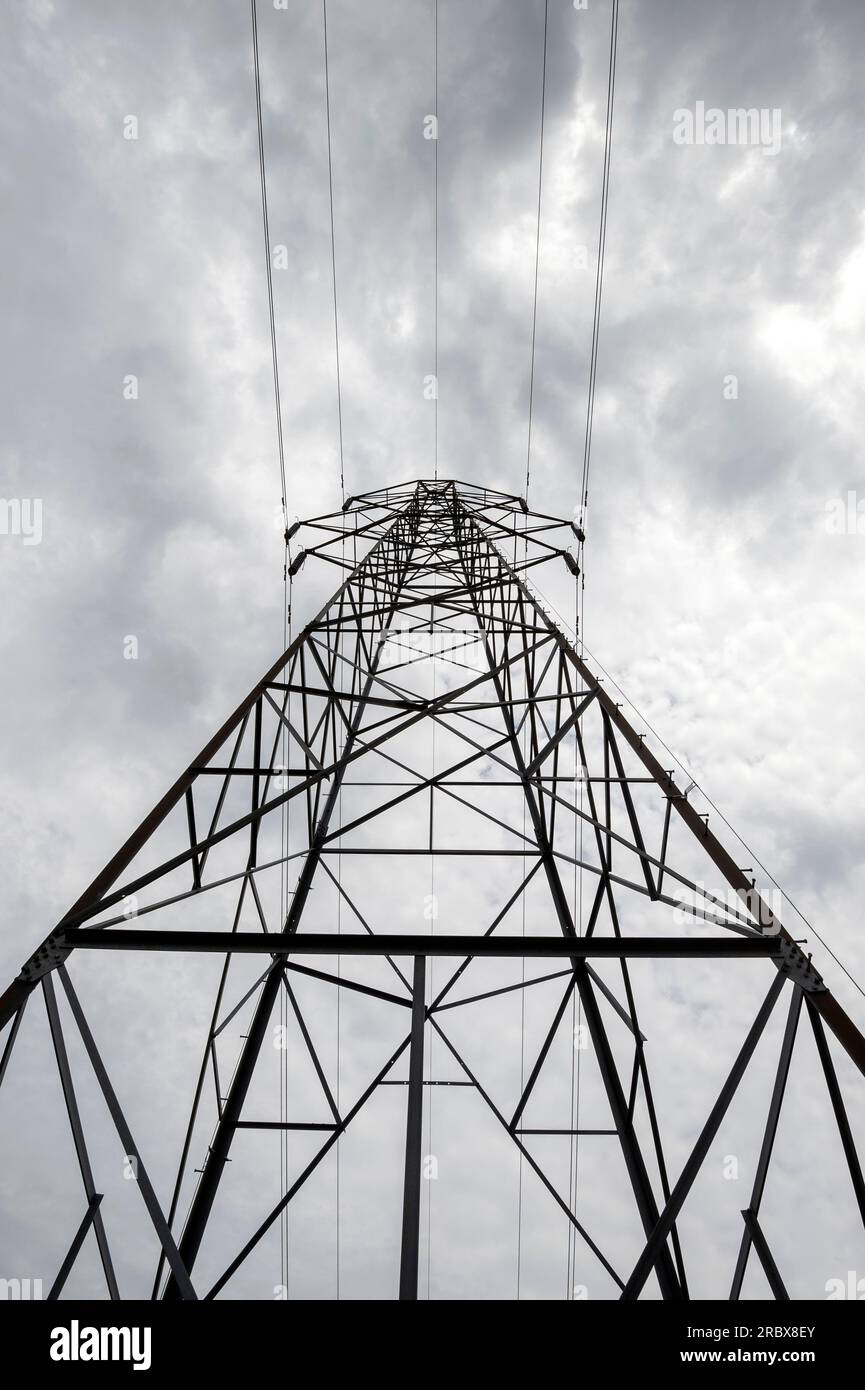 Electricity pylon against a moody sky Stock Photo