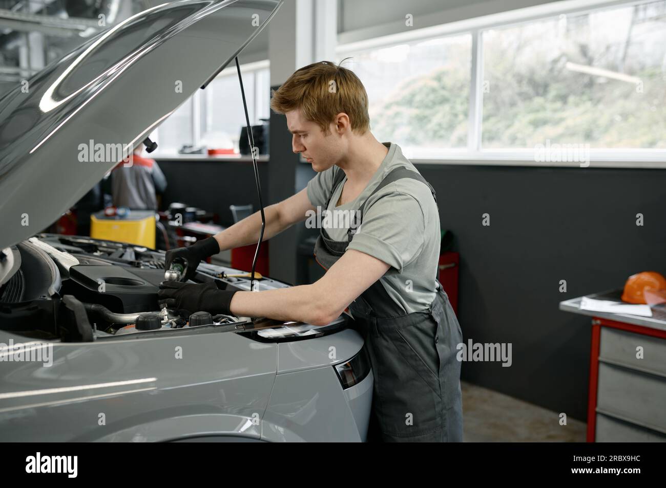 Man inspecting hood opened car hi-res stock photography and images - Alamy