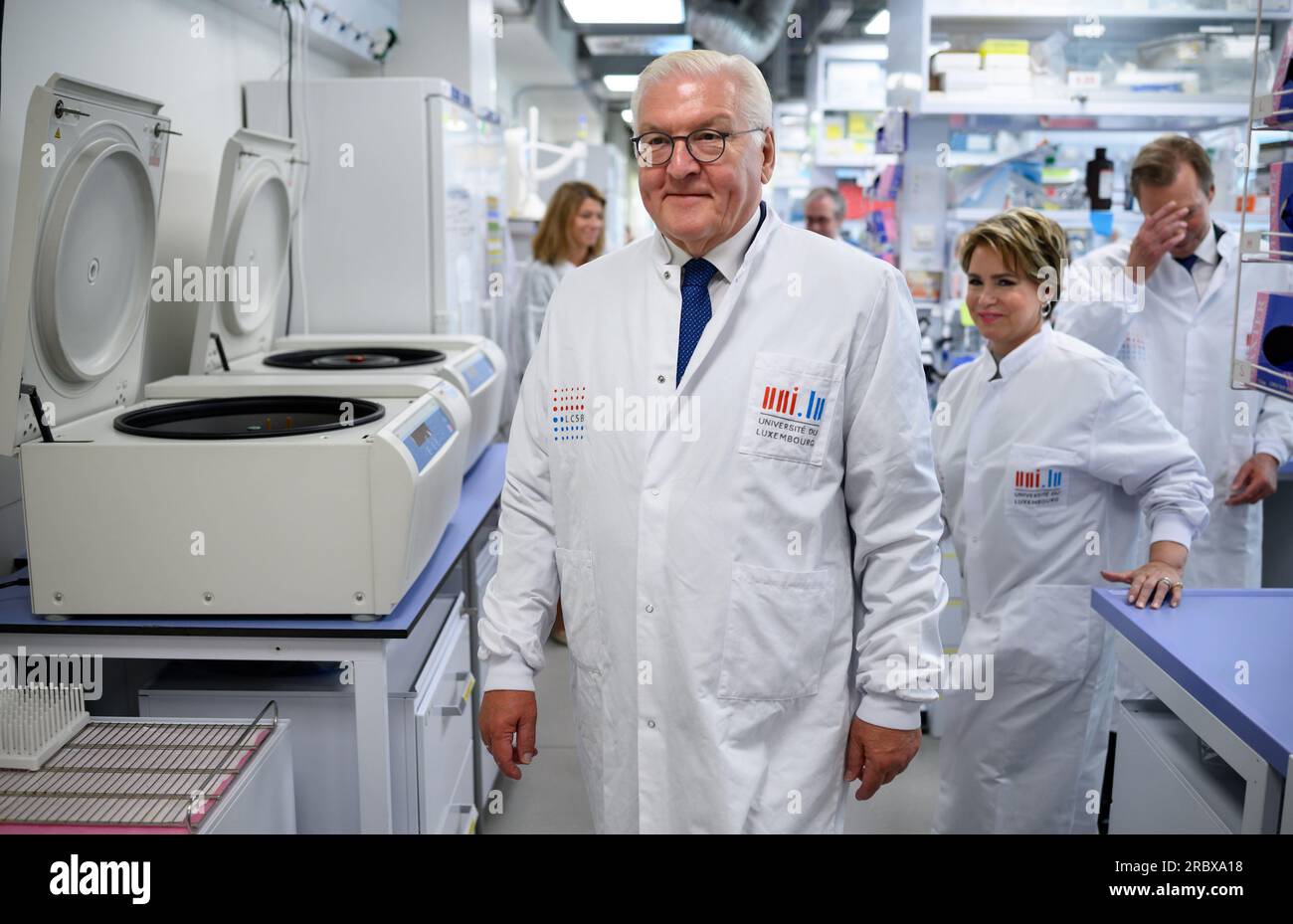Luxemburg, Luxembourg. 11th July, 2023. German President Frank-Walter Steinmeier walks through the Luxembourg Centre for Systems Biomedecine (LCSB) together with Grand Duke Henri of Luxembourg (r) and Grand Duchess Maria Teresa of Luxembourg. President Steinmeier and his wife are in Luxembourg for a two-day official visit. Credit: Bernd von Jutrczenka/dpa/Alamy Live News Stock Photo