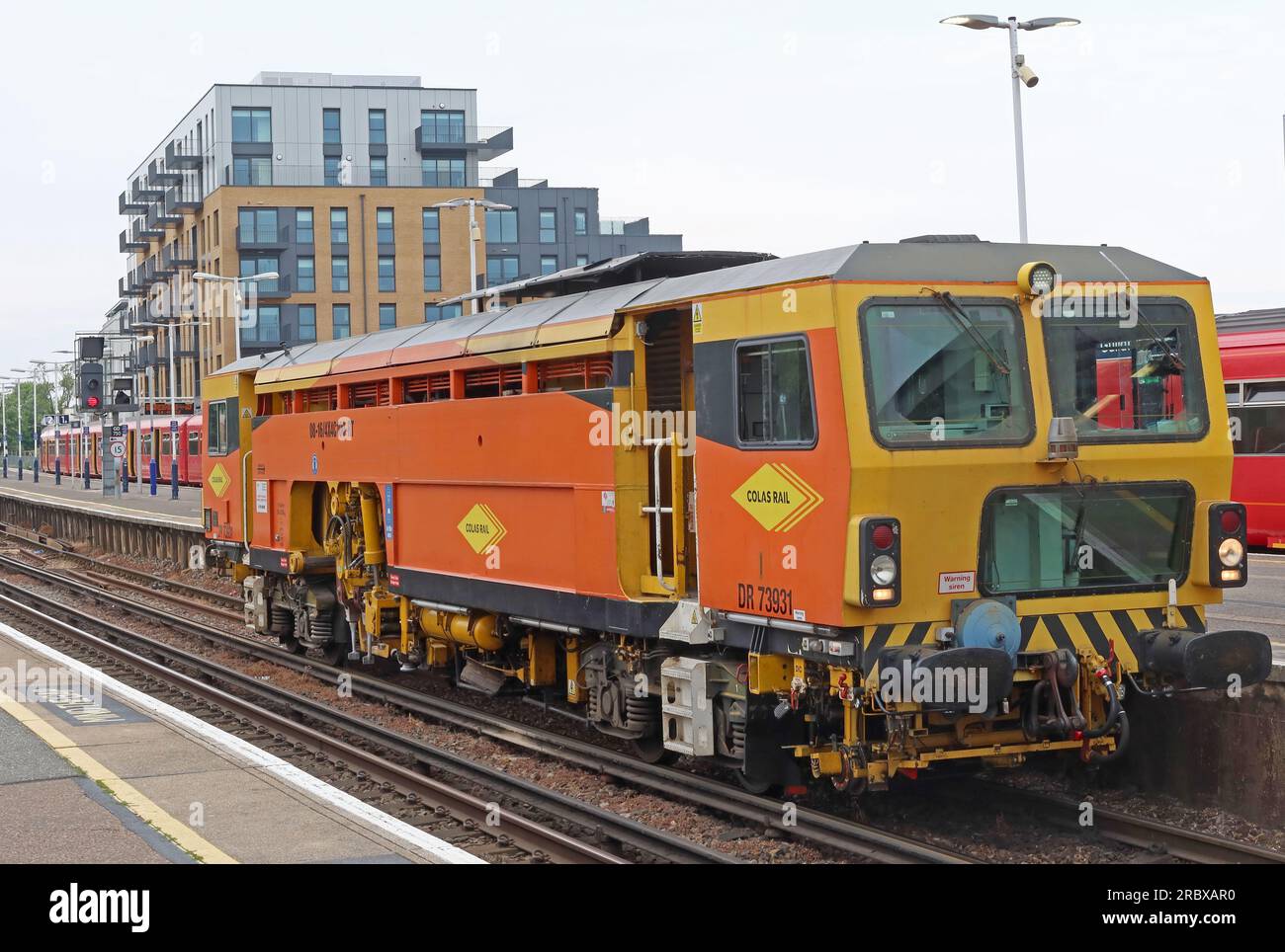 Colas Rail DR73931 - 08-16/4X4C100-RT track maintenance tamper, at Guildford station, Surrey, South East England, UK, GU1 4UT Stock Photo
