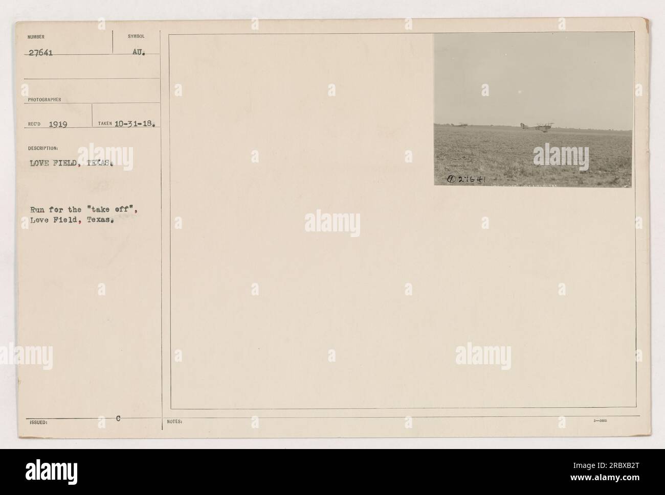 The photograph shows a symbolic moment at Love Field, Texas in 1919. The symbol issued is AU. The date the photograph was taken is October 31, 1918. It captures a run for the 'take off' at Love Field. The accompanying notes mention the number 21640 and the presence of three individuals. Stock Photo