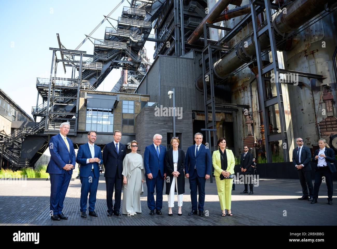 11 July 2023, Luxembourg, Luxemburg: German President Frank-Walter Steinmeier (4th from right) and his wife Elke Büdenbender (3rd from right) look on together with Grand Duke Henri of Luxembourg (3rd from left.)and Grand Duchess Maria Teresa of Luxembourg (M), as well as Yves Elsen (l-r), Chairman of the Supervisory Board of the University of Luxembourg, Jens Kreisel, Rector of the University of Luxembourg, Claude Meisch, Minister of Higher Education and Research, and Daniela Di Santo, Director of the Belval Fund, look at the Belval blast furnaces and the 'City of Science'. President Steinmeie Stock Photo