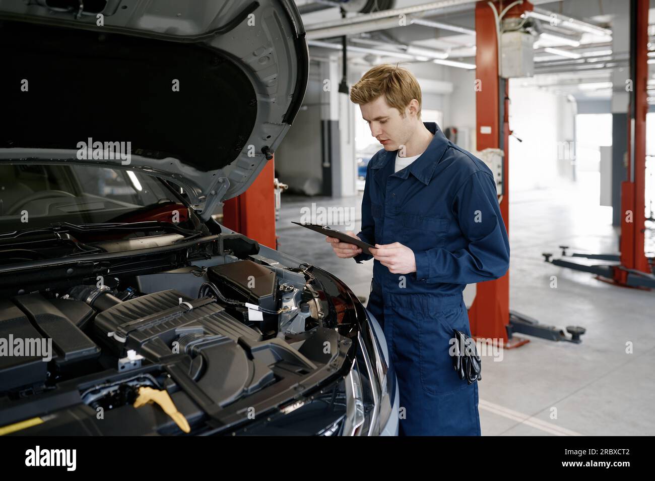 Hands of male car mechanic selecting wrench from tool box in repair garage  Stock Photo - Alamy