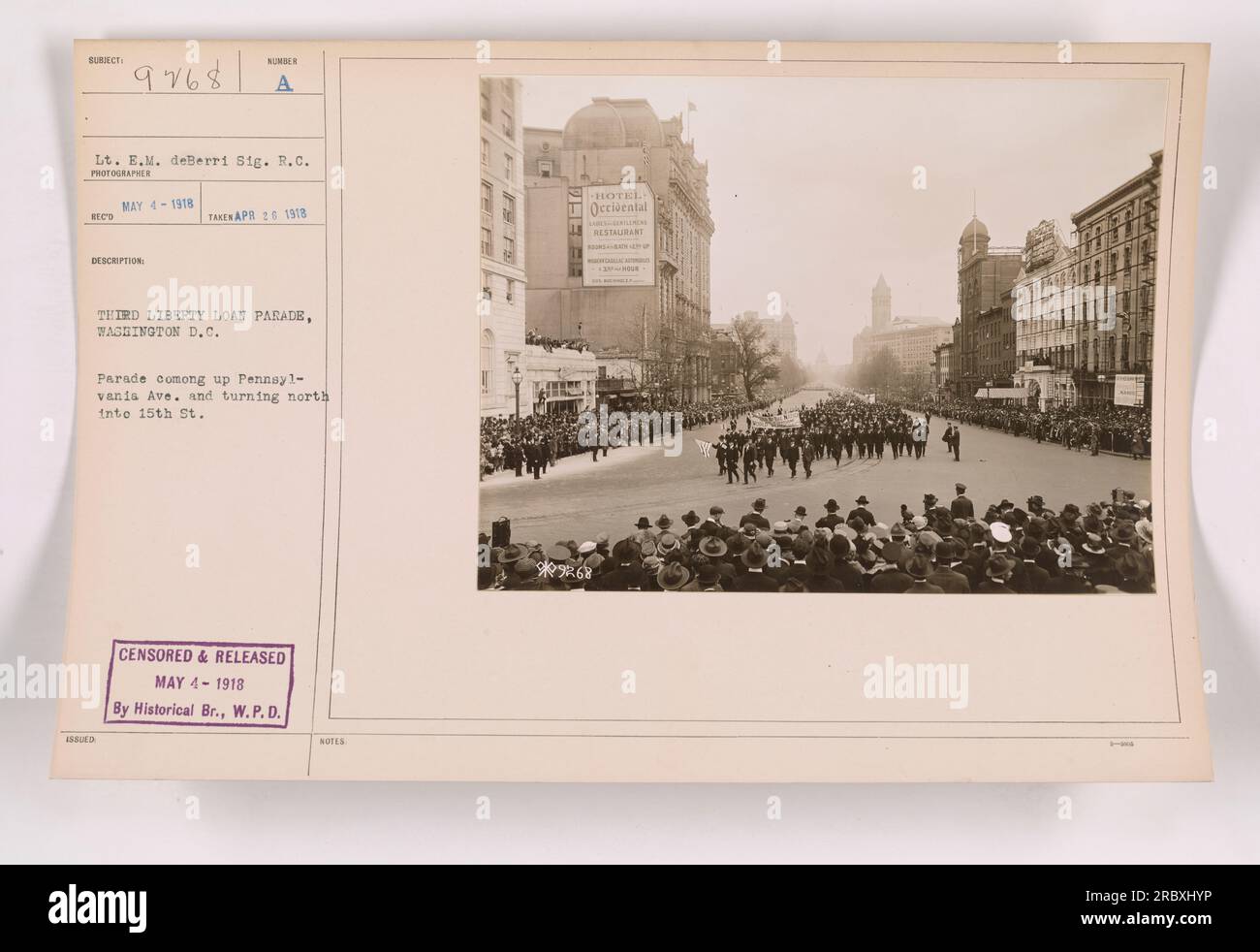 Lt. E.M. deBerri, a Signal Corps photographer, captured this photo on April 26, 1918, during the Third Liberty Loan parade in Washington D.C. The parade can be seen approaching Pennsylvania Avenue and turning north onto 15th Street. This image was censored and released on May 4, 1918, by the Historical Branch of W.P.D. Stock Photo