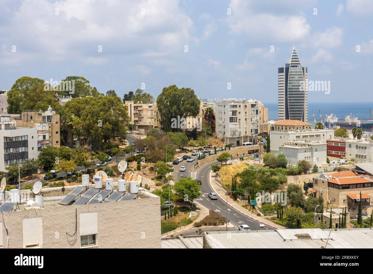 Haifa, Israel, May 24, 2023: Ministry of Interior building on the coast of the Mediterranean Sea. View of the 'rocket building' downtown and the Harbo Stock Photo