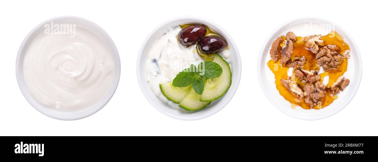 Cream yogurt, tzatziki, and Greek yogurt with honey and roasted walnuts, in white bowls. Stirred yoghurt, Greek dip sauce, and Yiaourti me meli. Stock Photo