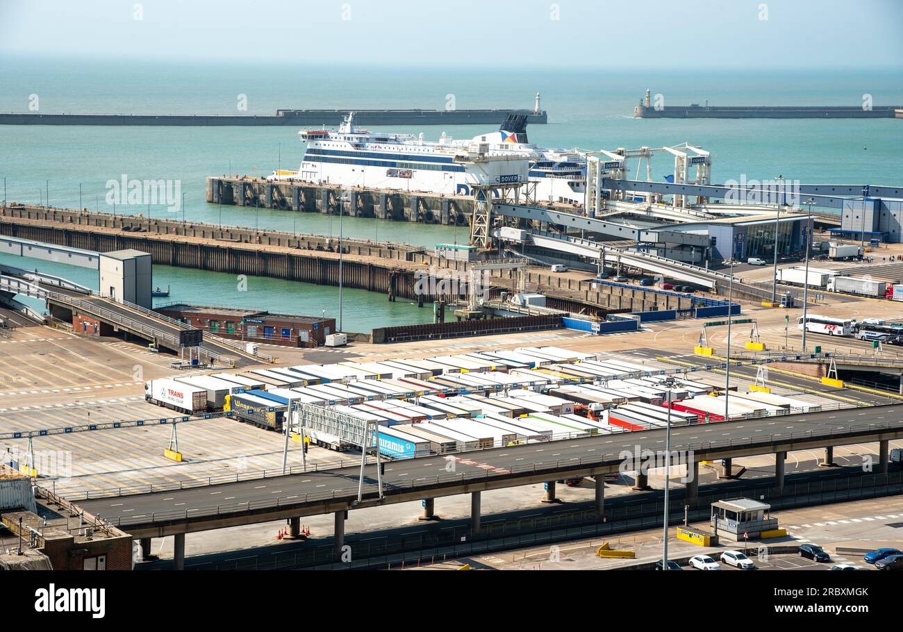 Trucks and ferries on port of Dover. Dover harbour connects Europe with