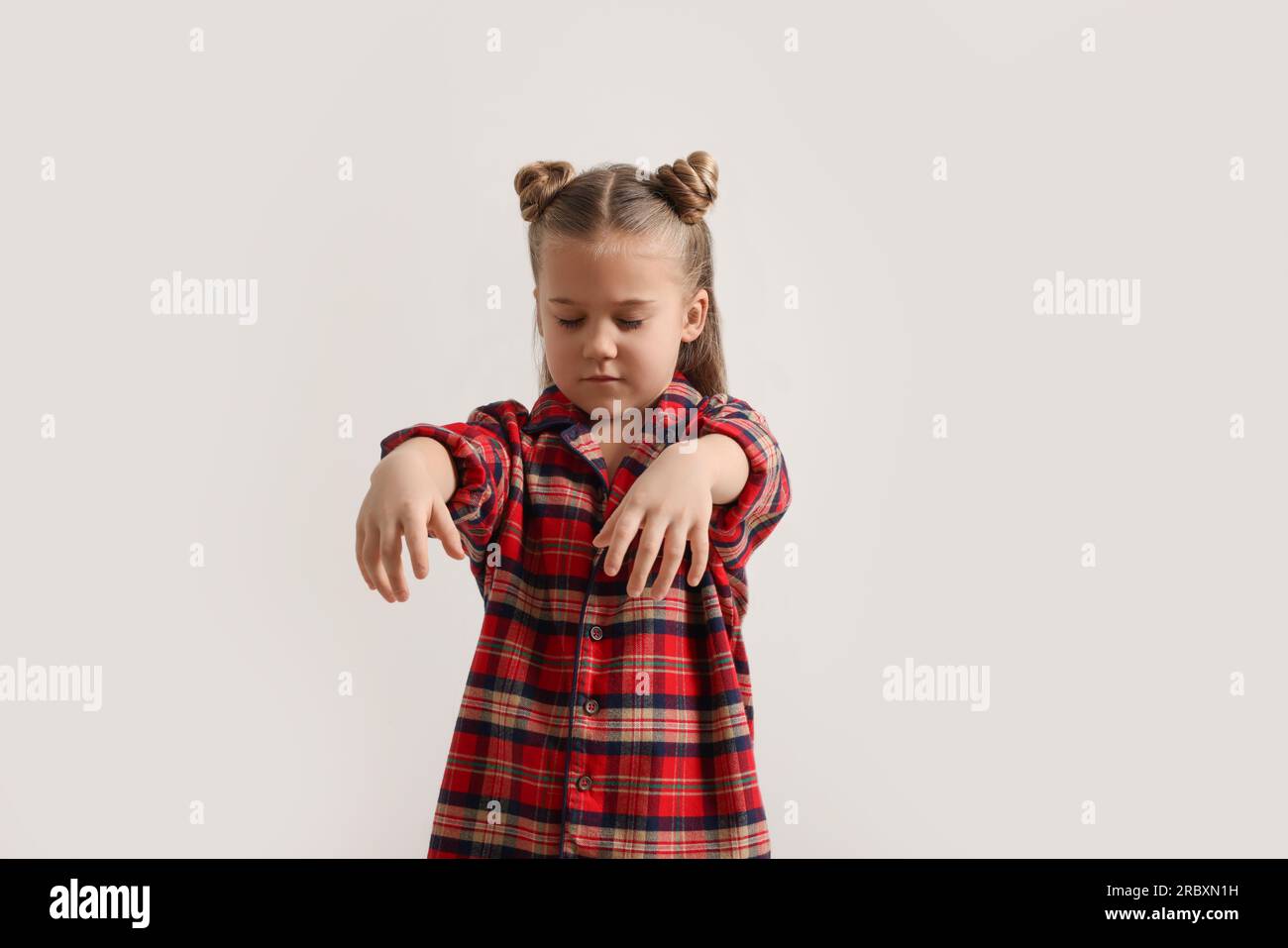 Girl in pajamas sleepwalking on white background Stock Photo Alamy
