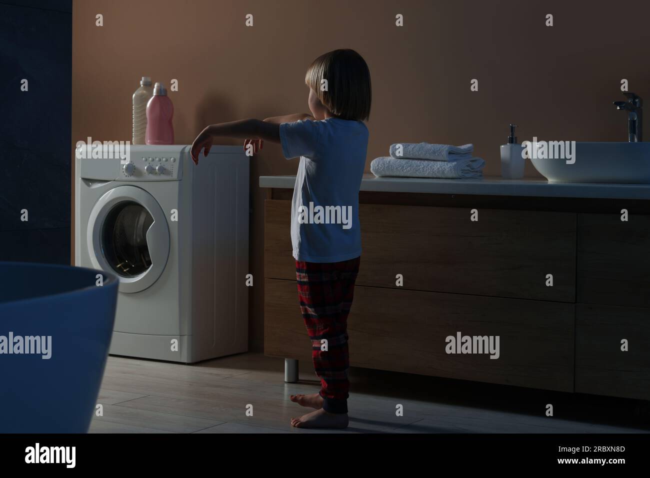 Boy in pajamas sleepwalking indoors at night Stock Photo Alamy
