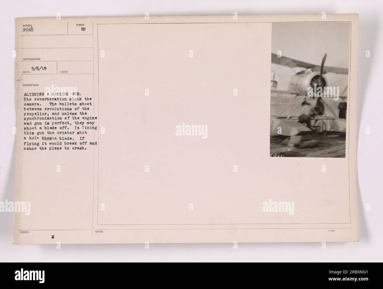 A soldier aligning a machine gun on an aircraft. The bullets pass