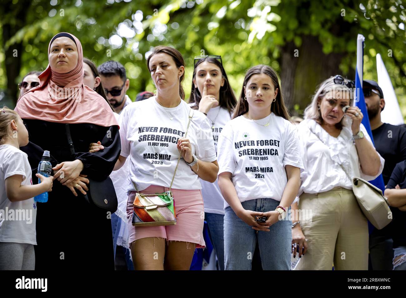 THE HAGUE - Participants in the annual Srebrenica commemoration, this year on the Plein. The siege of the Srebrenica enclave ended in genocide in 1995: more than 8,000 Muslim men and boys were murdered by Bosnian Serb troops. Since 1997, the victims of the atrocities have been commemorated annually on July 11. ANP ROBIN VAN LONKHUIJSEN netherlands out - belgium out Stock Photo