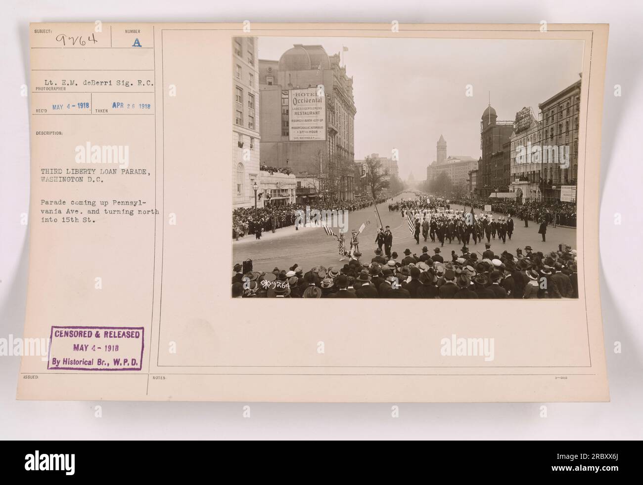 Image showing a parade during the Third Liberty Loan campaign in Washington D.C. on April 24, 1918. The parade is seen approaching Pennsylvania Ave and turning north into 15th St. This photograph was censored and released on May 4, 1918, by the Historical Branch of the War Plans Division. Stock Photo