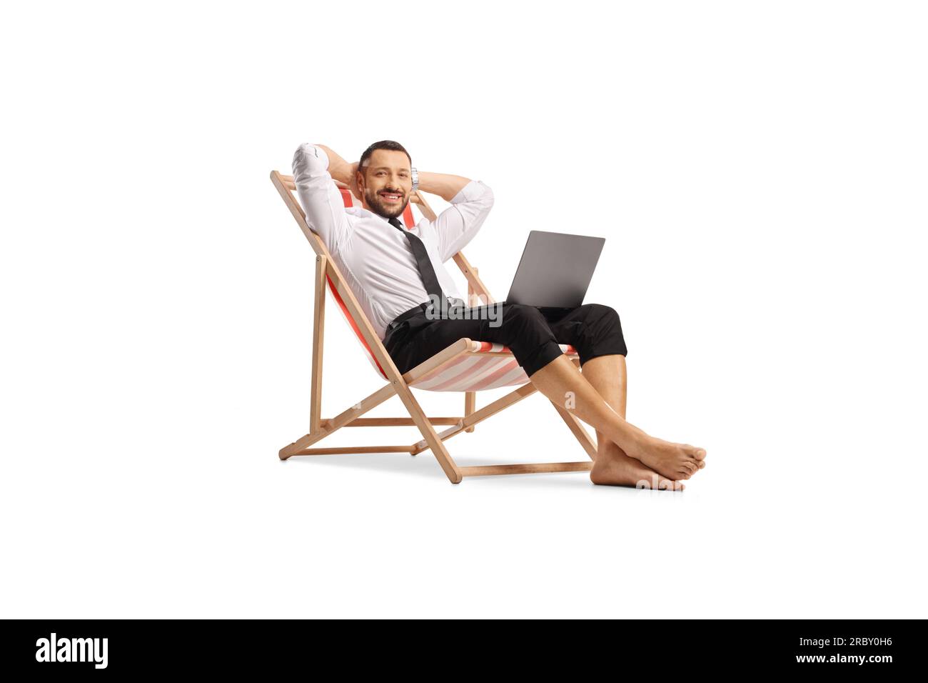 Relaxed bussinesman on a beach chair with a laptop computer isolated on white background Stock Photo