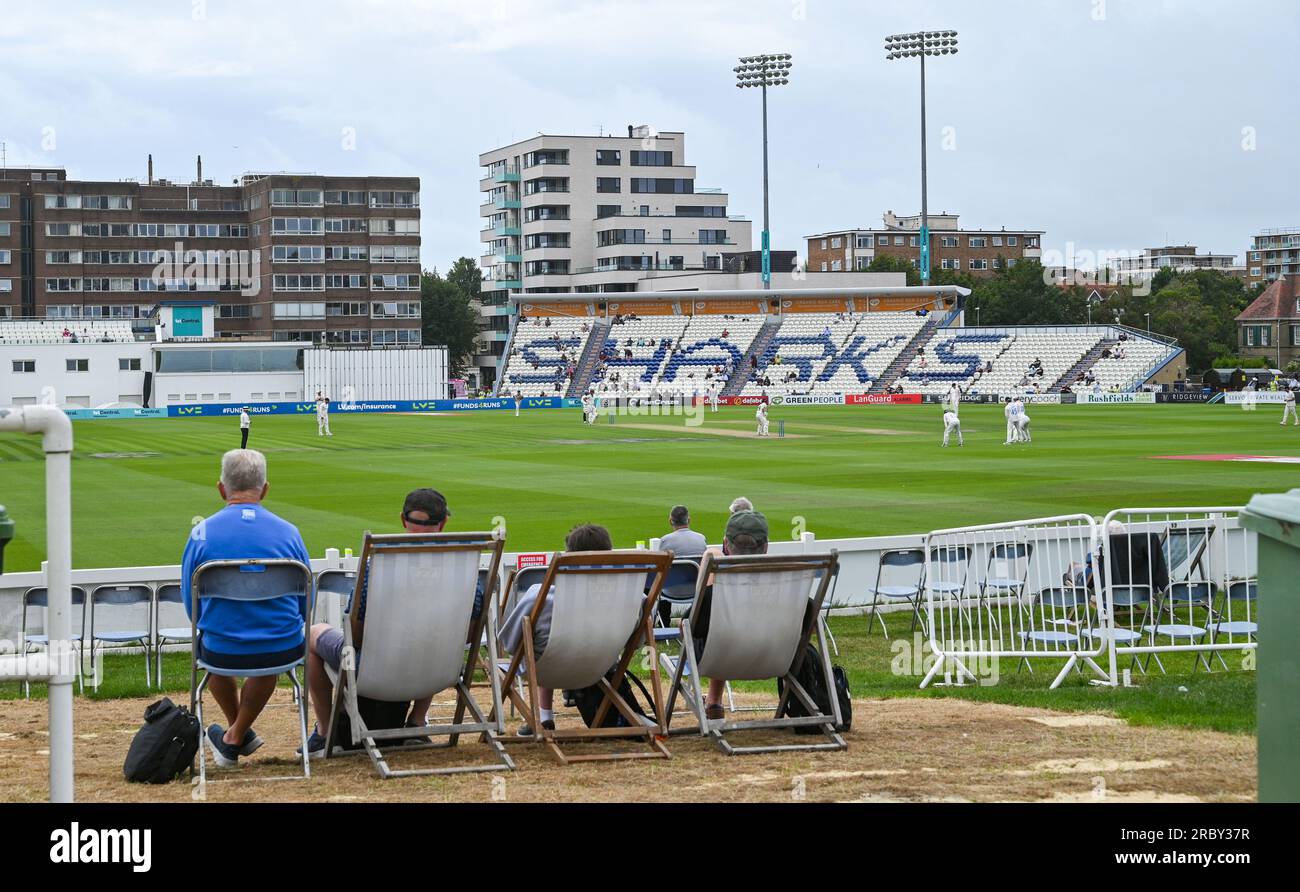 Hove UK 11th July 2023 -  Spectators watch Sussex take on Derbyshire in gloomy conditionsduring day two of the LV= Insurance County Championship cricket match at the 1st Central County Ground in Hove : Credit Simon Dack /TPI/ Alamy Live News Stock Photo