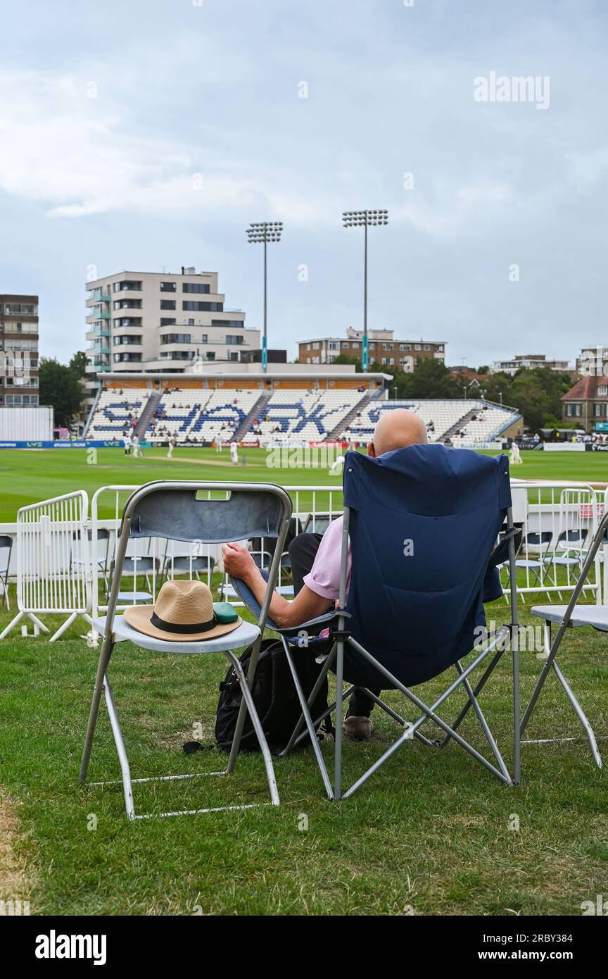 Hove UK 11th July 2023 -  Spectators watch Sussex take on Derbyshire in gloomy conditionsduring day two of the LV= Insurance County Championship cricket match at the 1st Central County Ground in Hove : Credit Simon Dack /TPI/ Alamy Live News Stock Photo