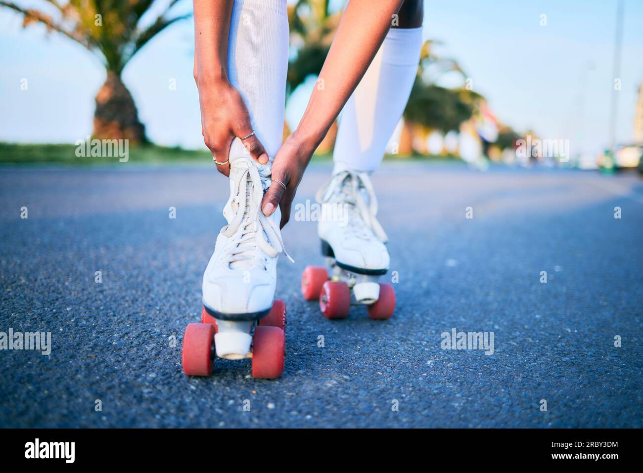 Leg injury, roller skates and hands on street for exercise accident