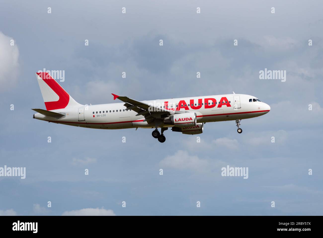 Lauda Europe Airbus A320 airliner jet plane on finals to land at London Stansted Airport, Essex, UK. Subsidiary of Ryanair Holdings Stock Photo