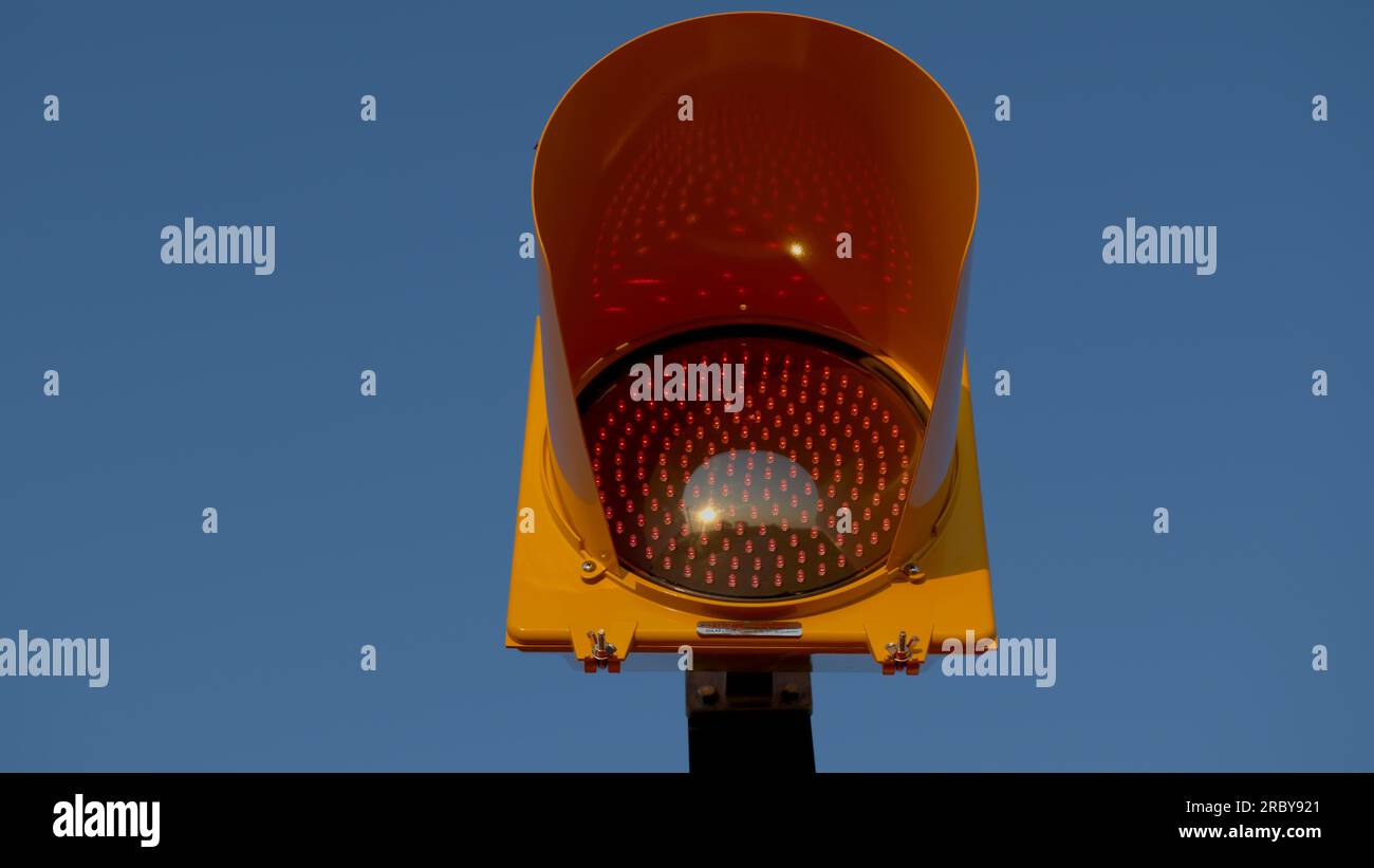 Lit Stop Sign Led-lit STOP signage on a blue sky. Isolated and copy-space Stock Photo ...