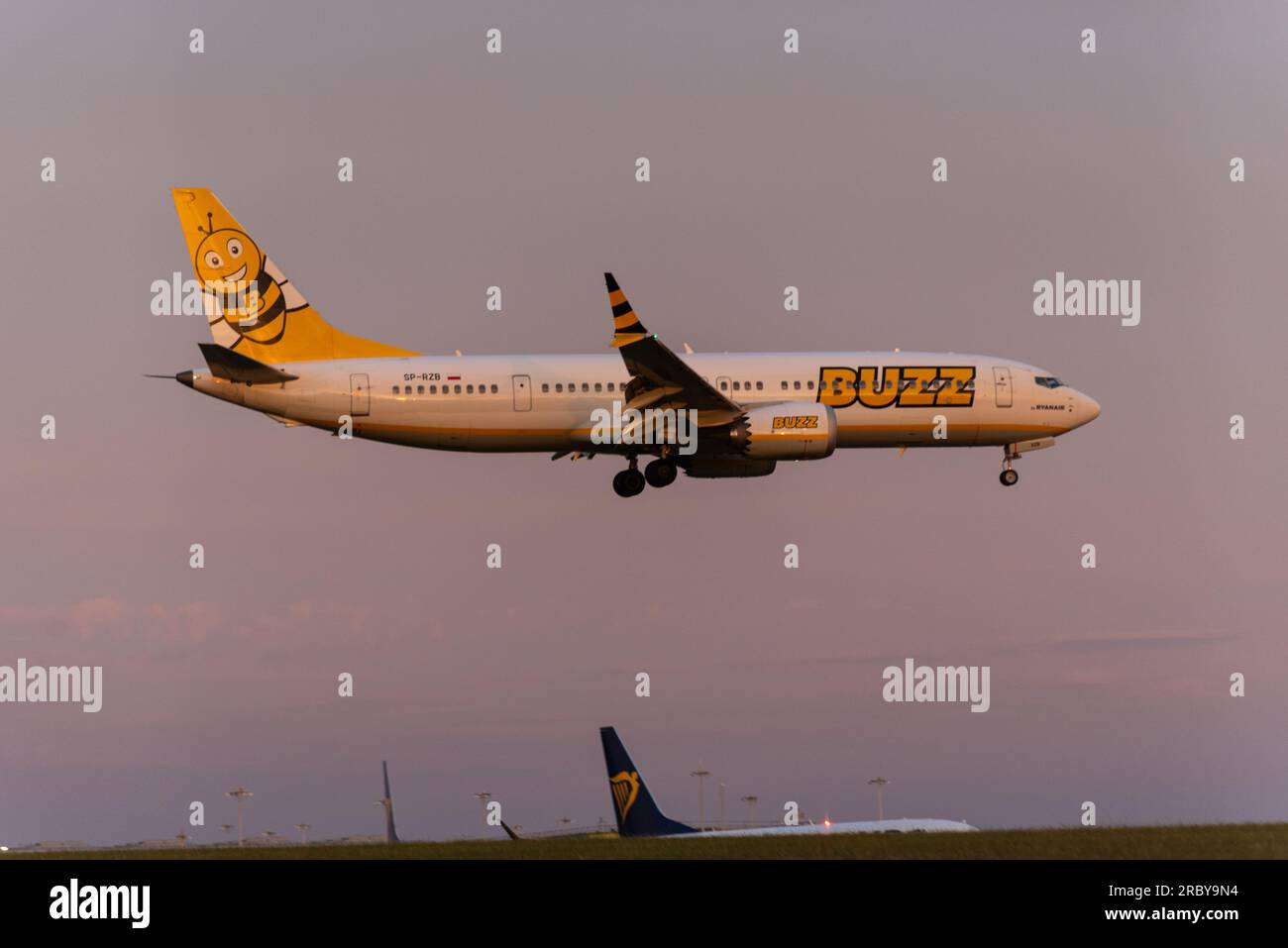 Buzz airline Boeing 737 MAX on finals to land at London Stansted Airport, Essex, UK. Boeing 737-8-200 MAX. Buzz is a Polish airline of Ryanair Stock Photo