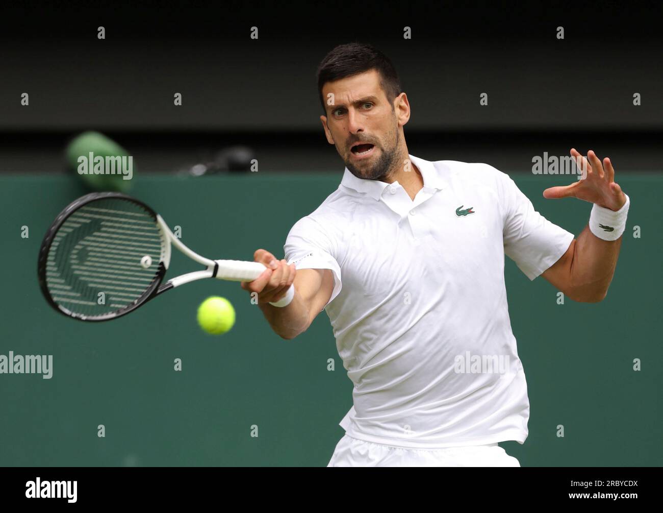 Novak Djokovic of Serbia hits a ball during the Gentlemens Singles Quarter-finals match against Andrey Rublev of Russia in the Championships, Wimbledon at All England Lawn Tennis and Croquet Club in London,