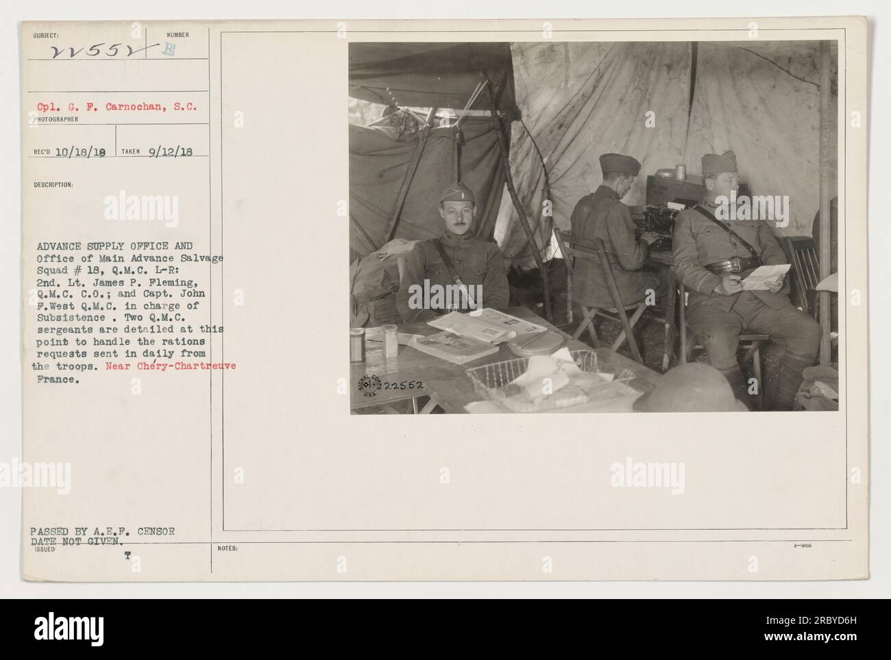 'Capt. John F. West and 2nd Lt. James P. Fleming of the Quartermaster Corps oversee operations at the Advance Supply Office and Main Advance Salvage Squad #18 in Chéry-Chartreuve, France. They are responsible for providing subsistence and handling daily rations requests from the troops. Two Q.M.C. sergeants are also detailed to assist in this task. Photograph taken on September 12, 1918, but censorship date not provided. Photo number 111-SC-22552 by Cpl. G.F. Carnochan, with official issue notes.' Stock Photo