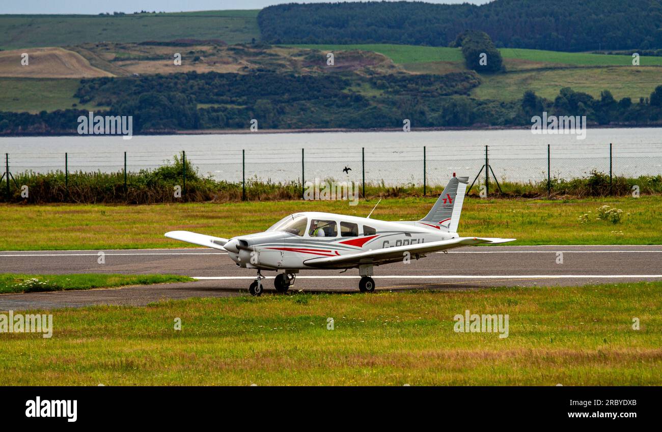 Private owned G-BPFH Piper PA-28-16 Warrior II aircraft landing at Dundee Riverside Airport, Scotland Stock Photo