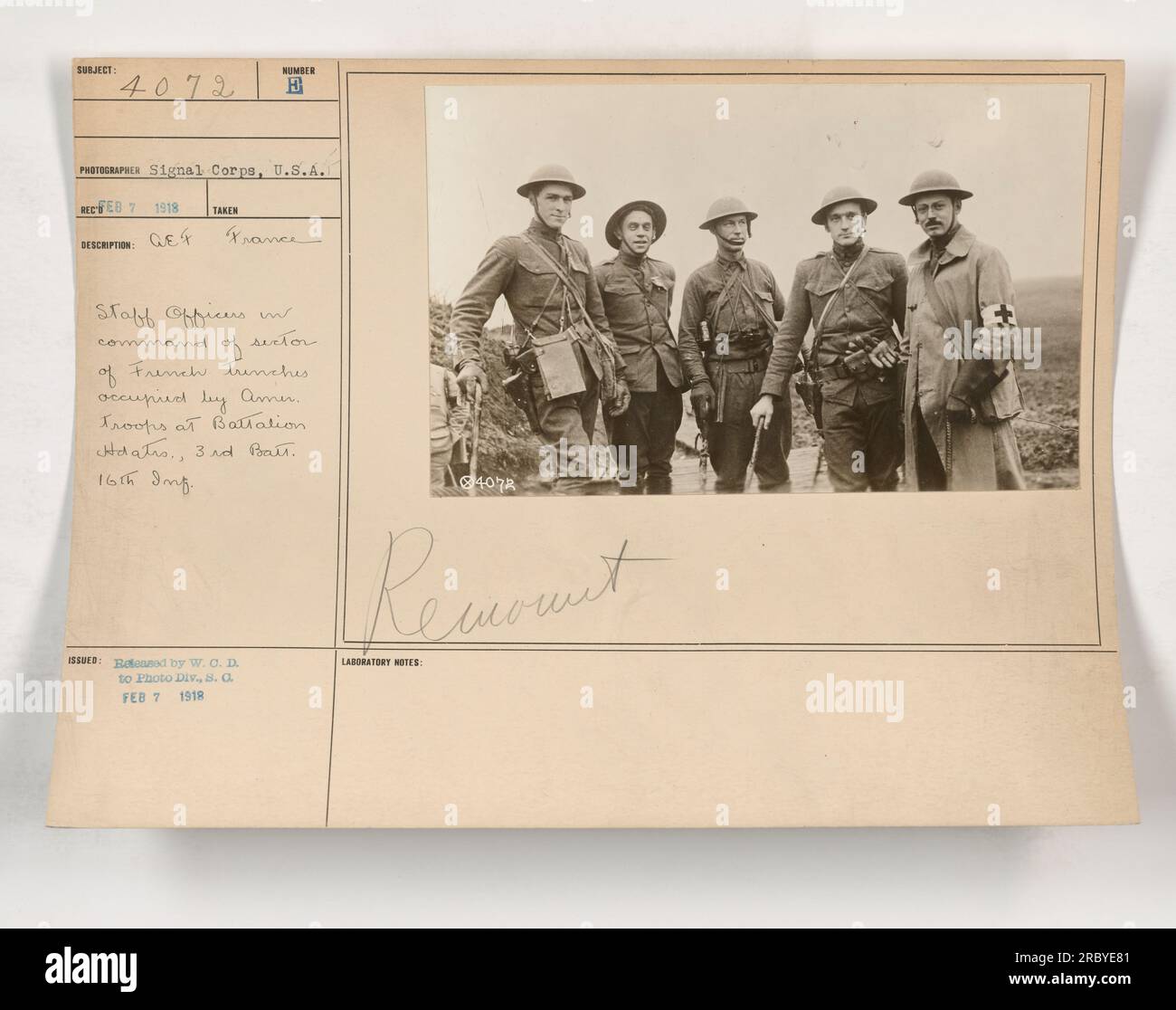 A group of staff officers from the American Expeditionary Forces (AEF) in France are seen in this photograph. They are responsible for commanding the sector of French trenches occupied by American troops at Battalion Headquarters, specifically the 3rd Battalion of the 16th Infantry Regiment. The photo was taken on an unknown date in 1918 and is part of the Signal Corps collection. It was later released to the Photo Division on February 7, 1918. It currently resides in the Remount Laboratory's records. Stock Photo