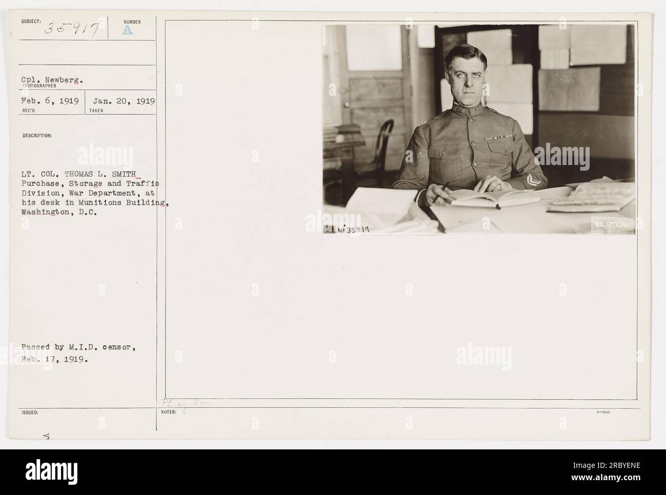 Cpl. Newberg, a photographer serving during World War One, captured this image on February 6, 1919. It shows Lt. Col. Thomas L. Smith, from the Purchase, Storage and Traffic Division of the War Department, working at his desk in the Munitions Building in Washington, D.C. The image was received and taken on January 20, 1919. It was subsequently passed by the M.I.D. censor on February 17, 1919. (50 words) Stock Photo