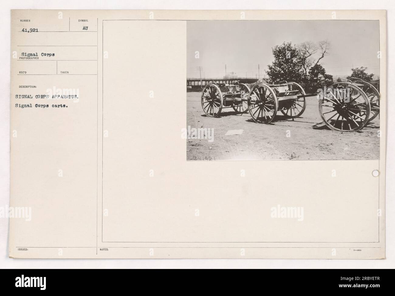A group of Signal Corps carts, with their distinctive symbol issued by the Signal Corps, captured in this photograph numbered 41,921 by a Signal Corps photographer. The image is one of the activities documented during World War One. The photo description mentions the presence of Signal Corps apparatus. Stock Photo
