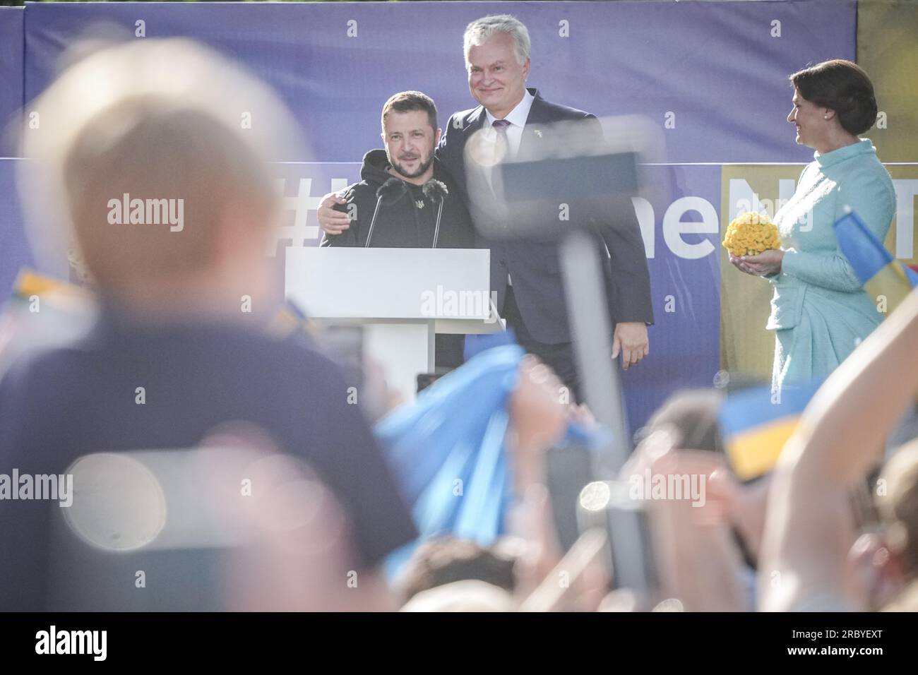 Vilnius, Lithuania. 11th July, 2023. Volodymyr Selenskyj, President of Ukraine, Gitanas Naus·da (M), President of Lithuania, and his wife Diana Nausediene stand on the sidelines of the NATO summit after a public address in the Lithuanian capital. Topics at the summit will include further steps to strengthen deterrence and defense. It will also discuss defense spending targets and continued support for Ukraine. Credit: Kay Nietfeld/dpa/Alamy Live News Stock Photo