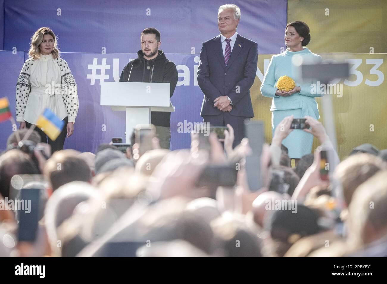 Vilnius, Lithuania. 11th July, 2023. Volodymyr Selenskyj, President of Ukraine, and his wife Olena Selenska sing the Ukrainian national anthem alongside Gitanas Naus·da (2nd vr), President of Lithuania, and his wife Diana Nausediene on the sidelines of the NATO summit after a public address in the Lithuanian capital. Among the topics to be discussed at the summit will be further steps to strengthen deterrence and defense. It will also discuss defense spending targets and continued support for Ukraine. Credit: Kay Nietfeld/dpa/Alamy Live News Stock Photo