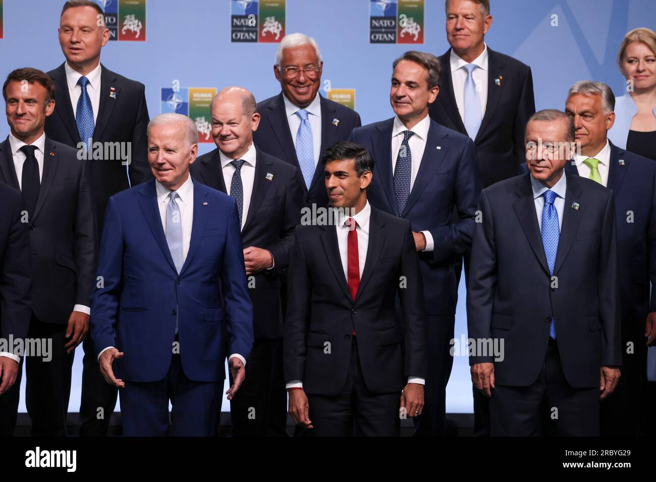 Vilnius, Lithuania. 11th July, 2023. U.S. President Joe Biden, left, stands together with British Prime Minister Rishi Sunak, center, and other leaders of NATO nations during the family photo at the start of the NATO Summit, July 11, 2023 in Vilnius, Lithuania. Credit: Simon Dawson/Simon Dawson/No 10 Downing Street/Alamy Live News Stock Photo